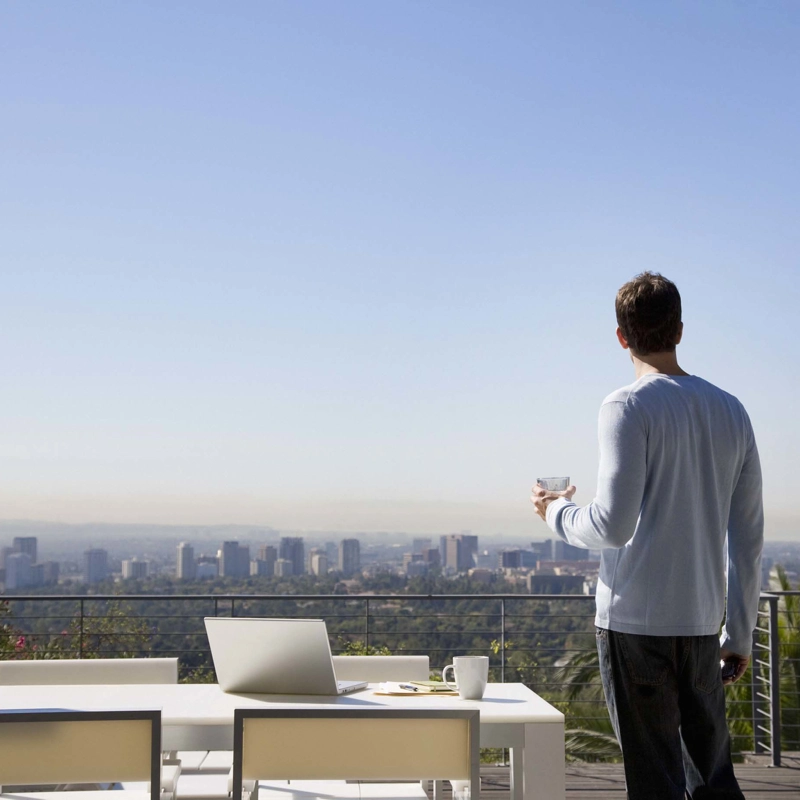 Man looking at a city skyline.