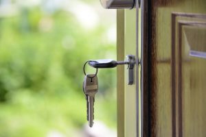 unlocking real estate opportunity closeup of keys on open door