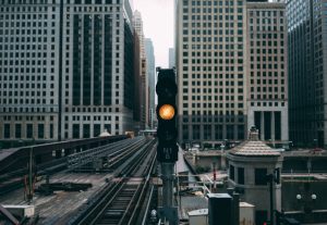 cityscape of subway track amber light to feature alternative investments