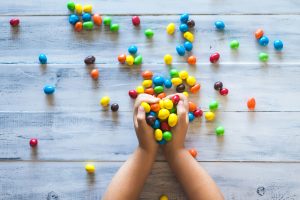 handful of candies to represent charitable giving
