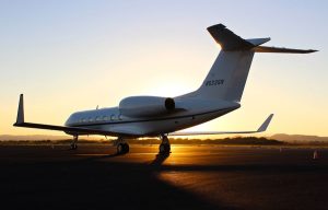 COVID19-winter-destination-flying-private-jet-sunset